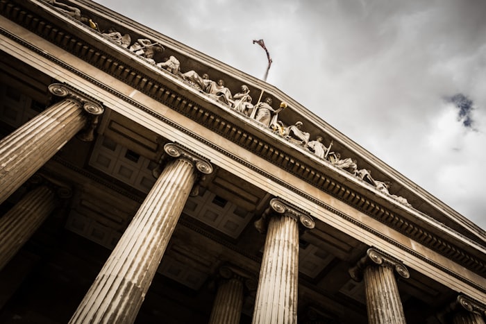 The columned facade of a neoclassical courthouse-style building.